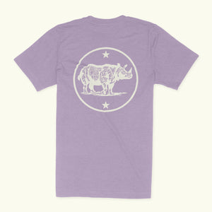 The back of a Heather Lavender shirt. The design on the shirt is a rhino surrounded by a circle. There are stars above and below the rhino.